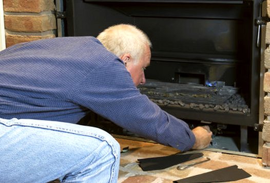 Gas log set out on the bench for service